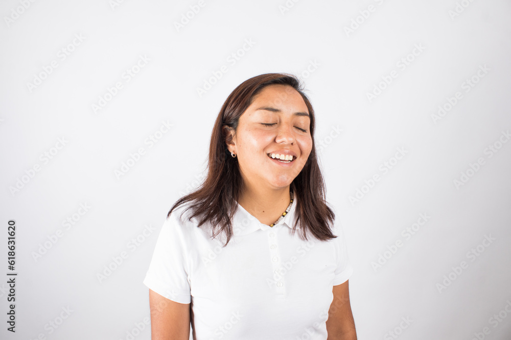photograph of latin woman smiling with her eyes closed. Concept of people and emotions. photograph of latin woman smiling with her eyes closed. Concept of people and emotions.