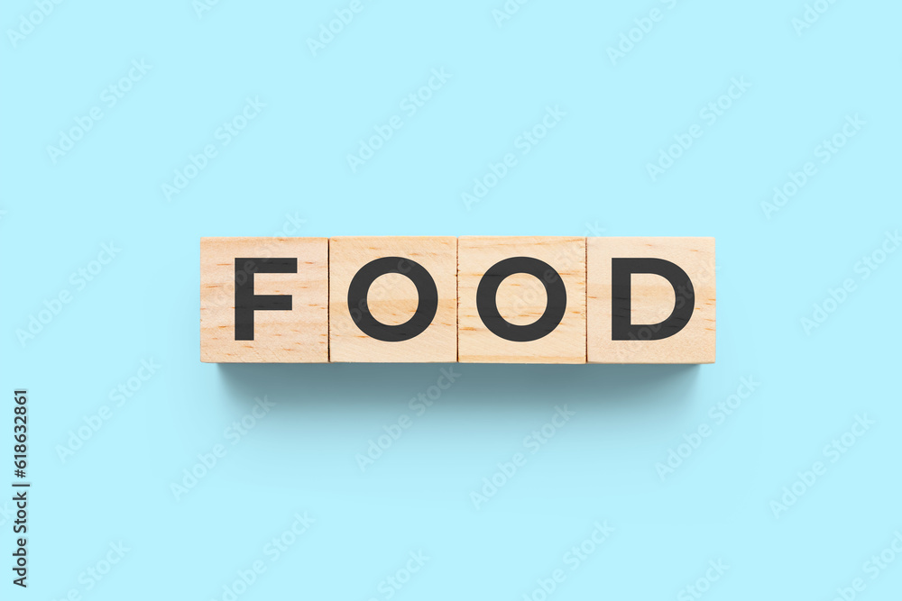 Food wooden cubes on blue background Food wooden cubes on blue background