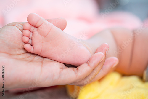Baby feet,Baby feet in hands, mother, mother and her baby, happy family concept, beautiful conception image of childbirth