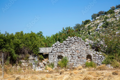 Sidyma Ancient City in Turkey. Rock tombs in Ancient Site of Sidyma, Mugla, Turkey photo
