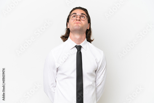 Business handsome man isolated on white background and looking up