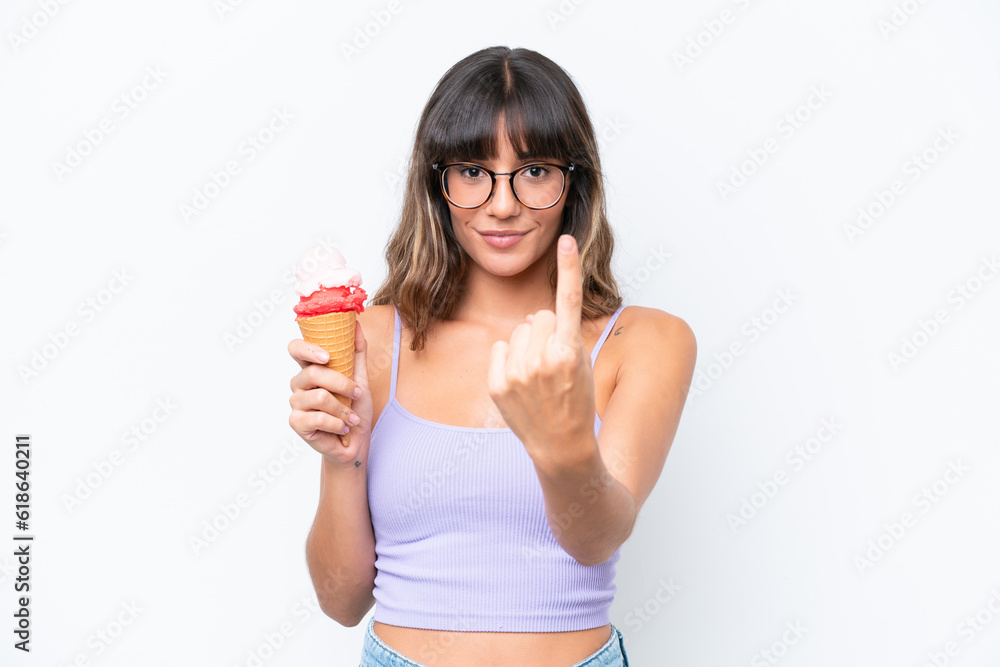 Young caucasian woman with a cornet ice cream over isolated white background doing coming gesture Young caucasian woman with a cornet ice cream over isolated white background doing coming gesture