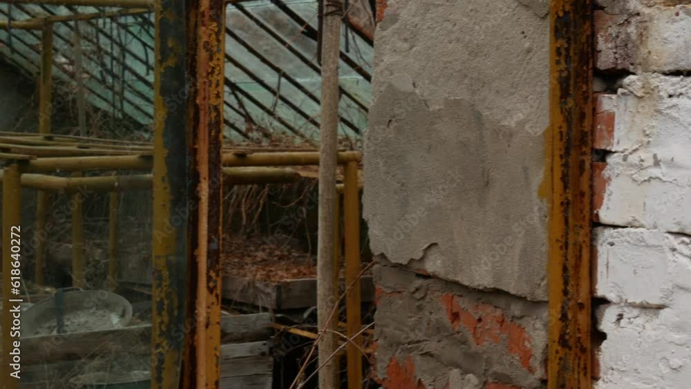 Video filming of metal and rusty racks for plants in a greenhouse. A slow transition from the whitewashed brick walls to the greenhouse. Video filming of metal and rusty racks for plants in a greenhouse. A slow transition from the whitewashed brick walls to the greenhouse.