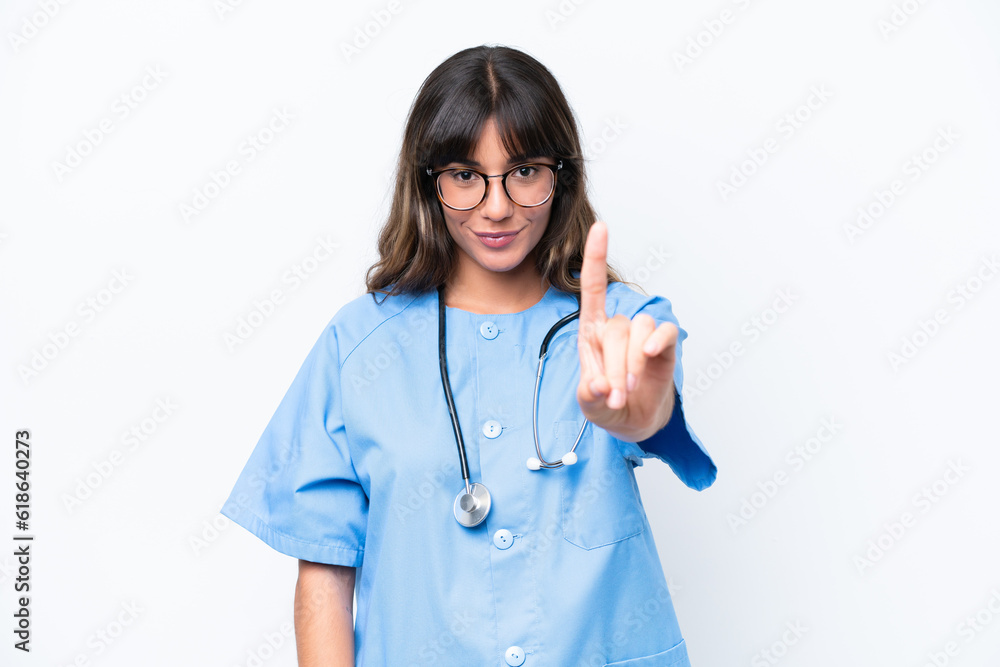 Young caucasian nurse woman isolated on white background showing and lifting a finger Young caucasian nurse woman isolated on white background showing and lifting a finger
