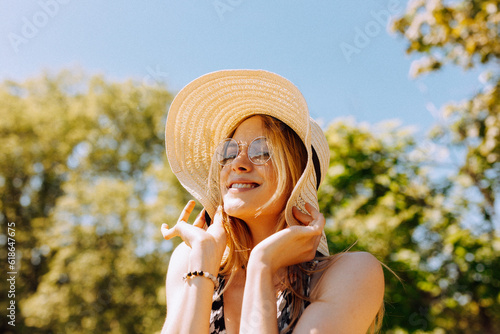 Woman bothered by intense summer sun