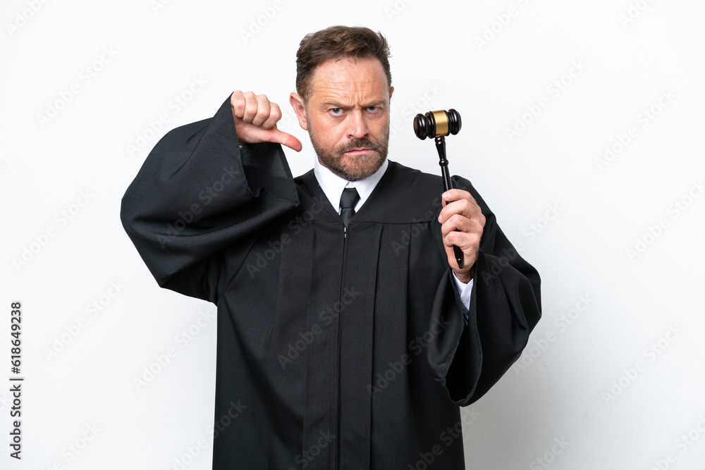 Middle age judge man isolated on white background showing thumb down with negative expression Middle age judge man isolated on white background showing thumb down with negative expression