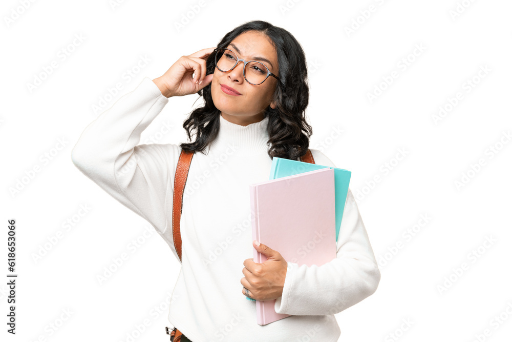 Young Argentinian student woman over isolated background having doubts and thinking Young Argentinian student woman over isolated background having doubts and thinking