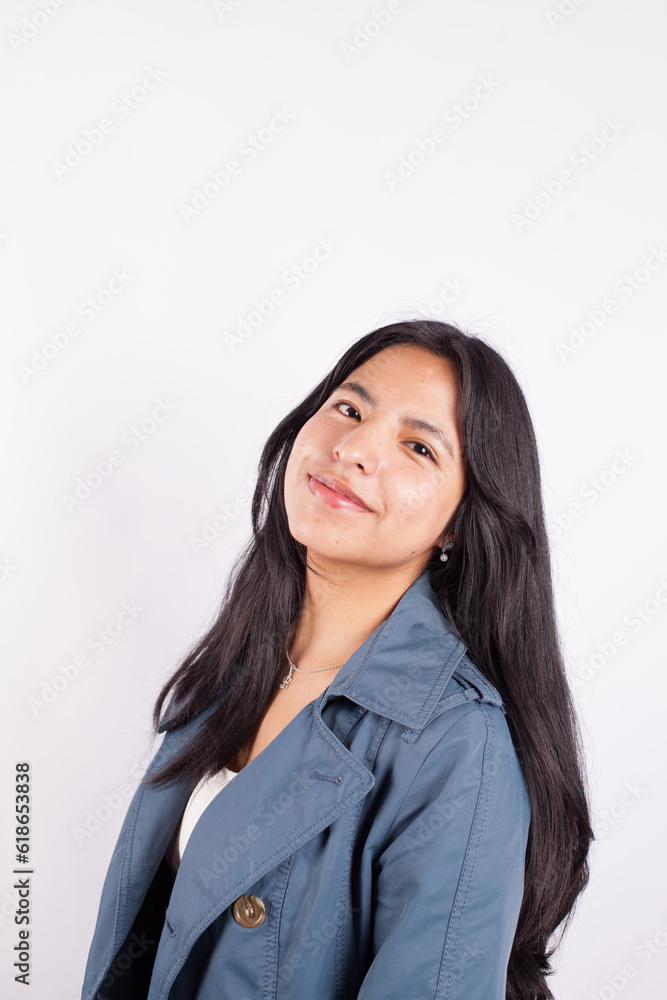 Portrait of young attractive hispan woman on a light background of photographic studio. Concept of people. Portrait of young attractive hispan woman on a light background of photographic studio. Concept of people.