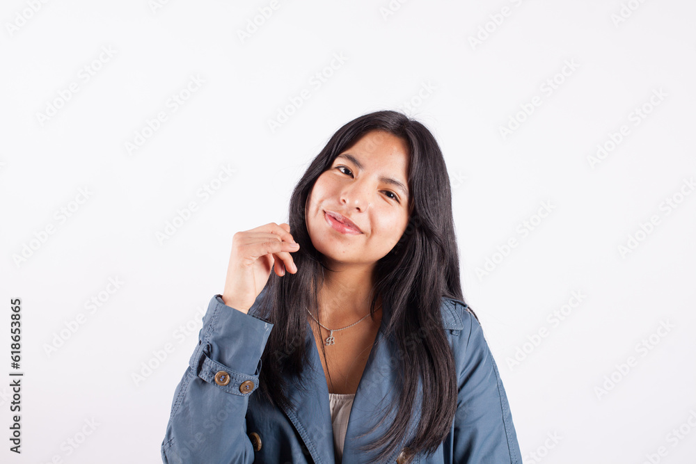 Portrait of young attractive hispan woman on a light background of photographic studio. Concept of people. Portrait of young attractive hispan woman on a light background of photographic studio. Concept of people.