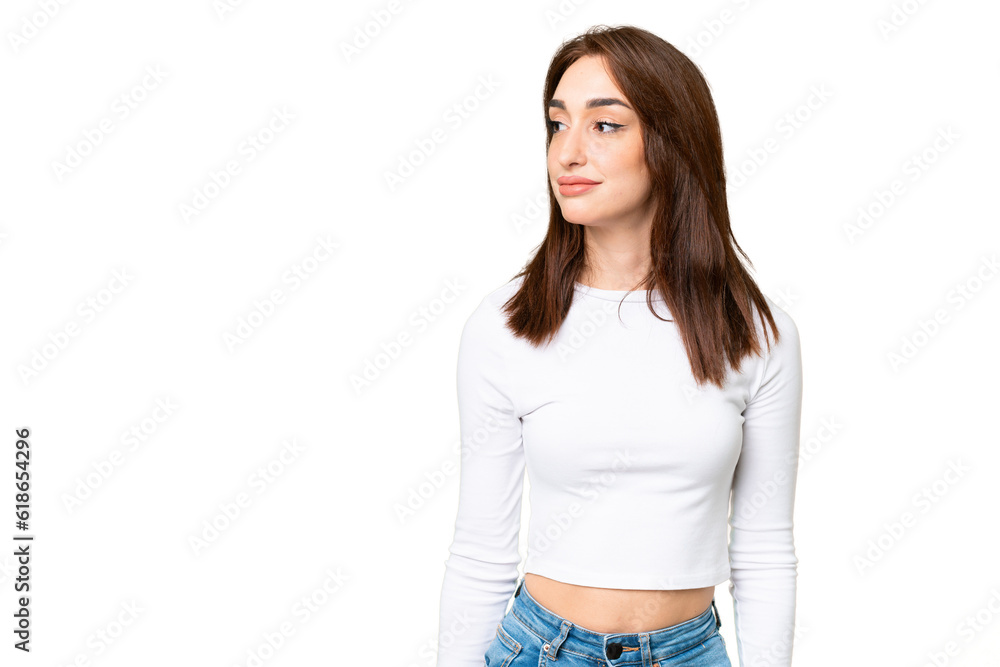 Young caucasian woman over isolated chroma key background looking to the side Young caucasian woman over isolated chroma key background looking to the side