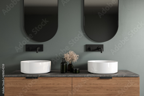 Chic bathroom setup with white double sink  soap dispensers  faucet  mirror  green wall background. Ideal for showcasing your products in a stylish and modern setting. Mock up. 3d rendering