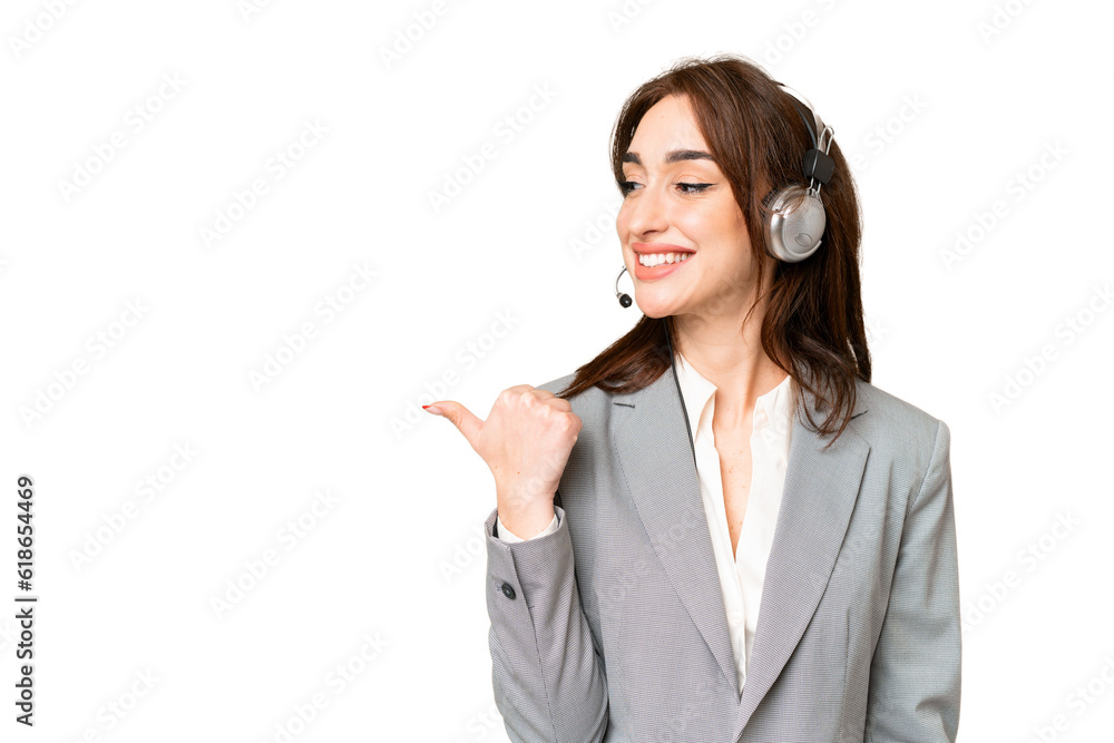 Telemarketer caucasian woman working with a headset over isolated chroma key background pointing to the side to present a product Telemarketer caucasian woman working with a headset over isolated chroma key background pointing to the side to present a product