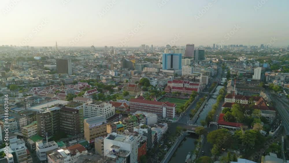 Aerial top view of Wat Ratchanatdaram Pagoda, a buddhist temple or Wat Saket in Bangkok Downtown, urban city with sunset sky, Thailand. Thai architecture landscape background. Aerial top view of Wat Ratchanatdaram Pagoda, a buddhist temple or Wat Saket in Bangkok Downtown, urban city with sunset sky, Thailand. Thai architecture landscape background.