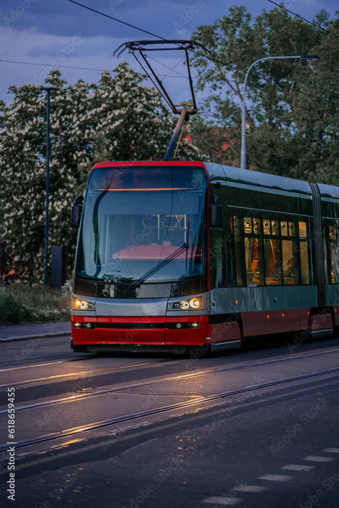 A modern tram in the streets of Prague's old town in 2023.