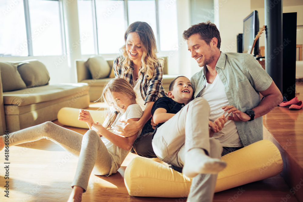 Young family playing in the living at home Young family playing in the living at home