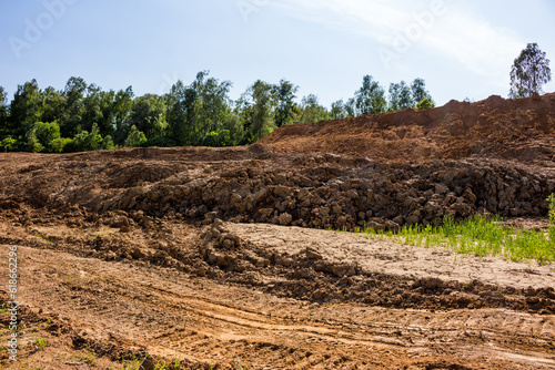 Excavated earth with heaps of clay soil