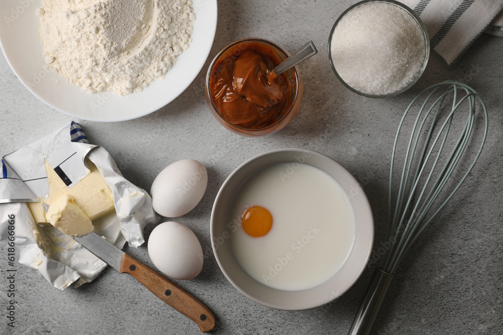 Ingredients for homemade walnut shaped cookies on grey table, flat lay Ingredients for homemade walnut shaped cookies on grey table, flat lay