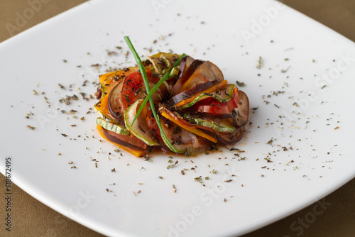 Fotografía Gourmet Ratatouille - Roasted Mediterranean Vegetables with Herbs on White Plate