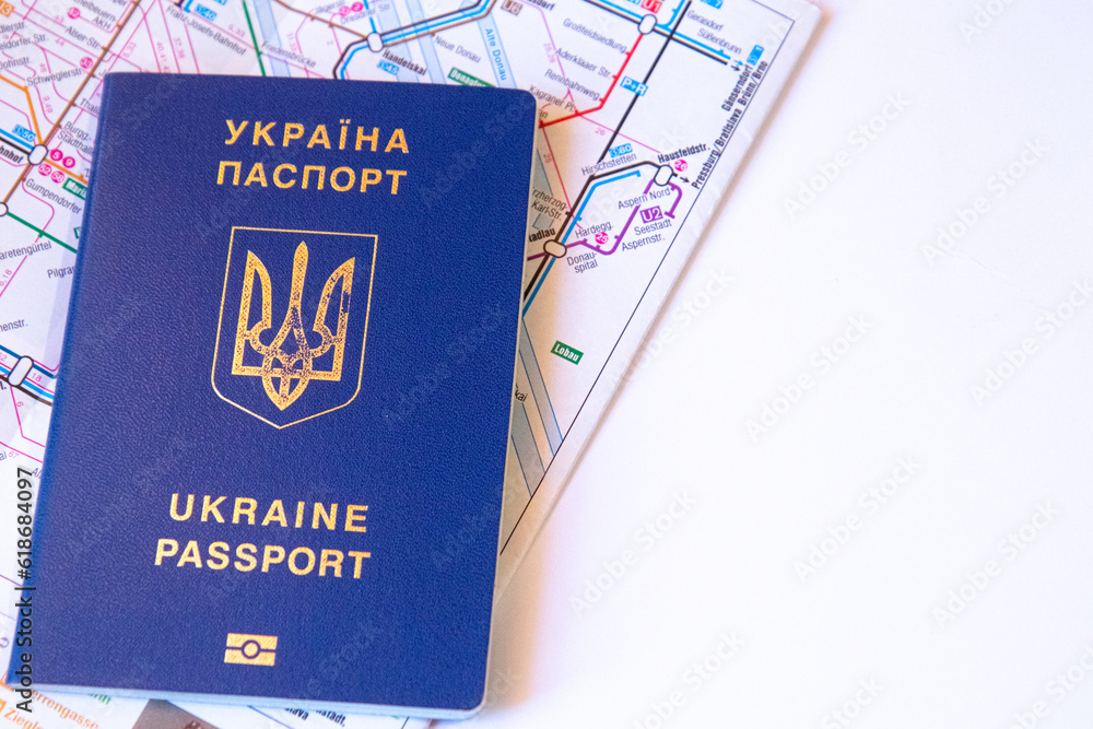 Fototapeta premium Close up view of Ukrainian passport on the map of transport in city in EU. Copy space. White background