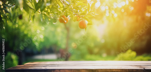 Empty wooden table top, texture board, on a blurred background of an orchard, trees in blurred bokeh