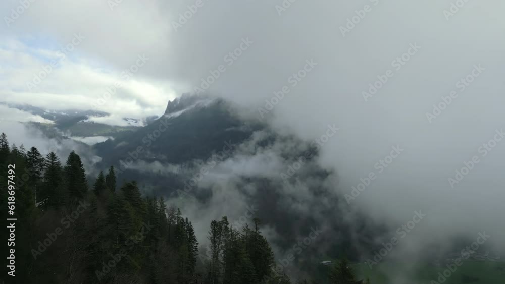 Tranquil woods, surrounded by misty clouds. Majestic mountains with their snowy peaks. Pure and untouched landscape. High quality 4k footage. Interlaken, Switzerland Tranquil woods, surrounded by misty clouds. Majestic mountains with their snowy peaks. Pure and untouched landscape. High quality 4k footage. Interlaken, Switzerland