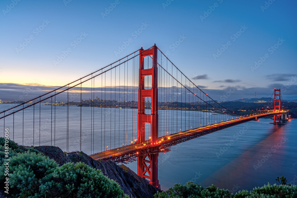 The Golden Gate Bridge with San Francisco in the back at dawn