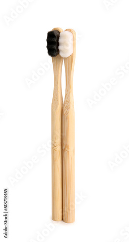 Bamboo tooth brushes on white background