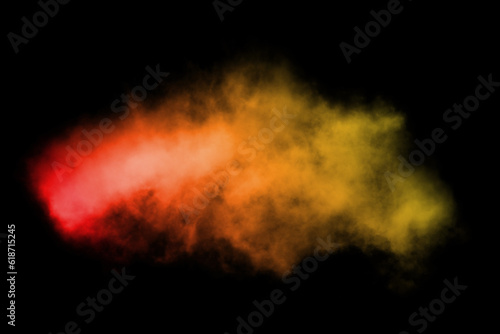 Color smoke. Paint water mix. Fire flame. Red yellow burning glowing glitter vapor texture on dark black abstract art background with free space. © Philip