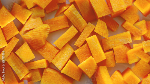 carrot cut into cubes close-up. A set of vitamins. Vegan food. Healthy food. Horizontal image.