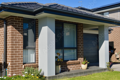 A closeup of a modern house in a residential suburb