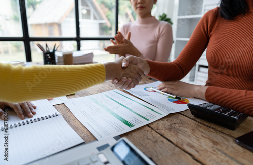 Confident businesswoman shaking hands after finishing meeting business success Confirmation of the company's mutual investment agreement.