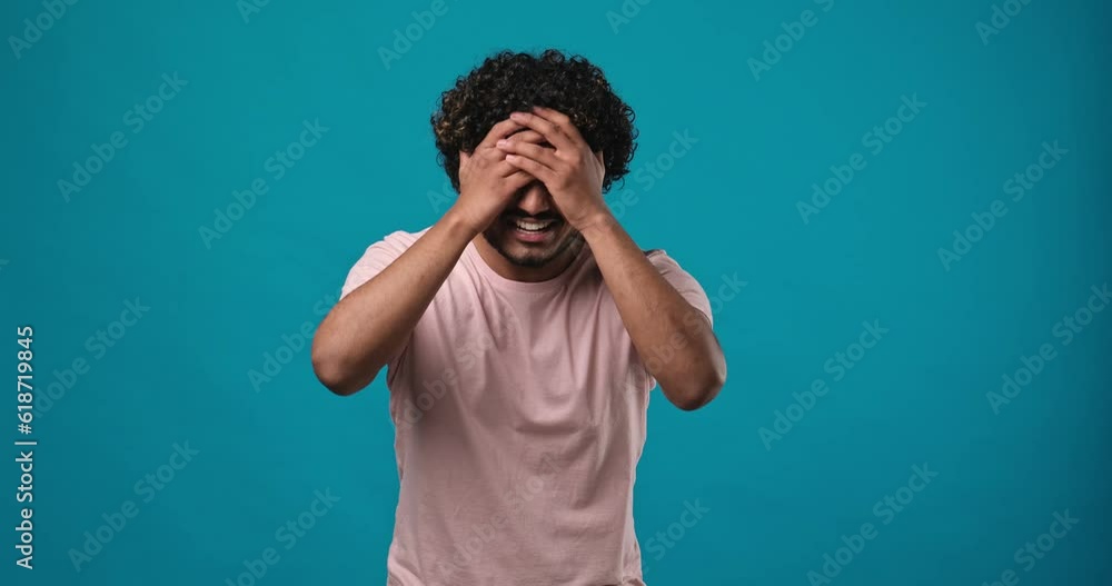 Frustrated indian man raising his hands and shrugging his shoulders with an indignant expression, asking the reason for the failure, showing disappointment, chagrin due to problems Frustrated indian man raising his hands and shrugging his shoulders with an indignant expression, asking the reason for the failure, showing disappointment, chagrin due to problems