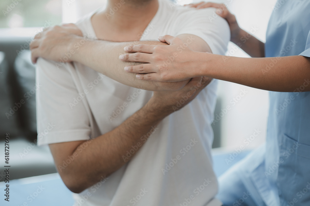 A professional physiotherapist is doing stretching for a patient, the patient has muscle dysfunction due to hard work, most often an office worker who has problems sitting for long periods of time. A professional physiotherapist is doing stretching for a patient, the patient has muscle dysfunction due to hard work, most often an office worker who has problems sitting for long periods of time.