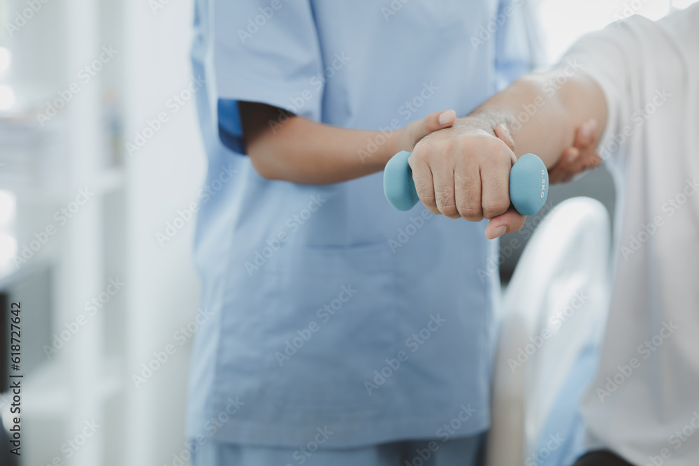 A professional physiotherapist is doing stretching for a patient, the patient has muscle dysfunction due to hard work, most often an office worker who has problems sitting for long periods of time. A professional physiotherapist is doing stretching for a patient, the patient has muscle dysfunction due to hard work, most often an office worker who has problems sitting for long periods of time.