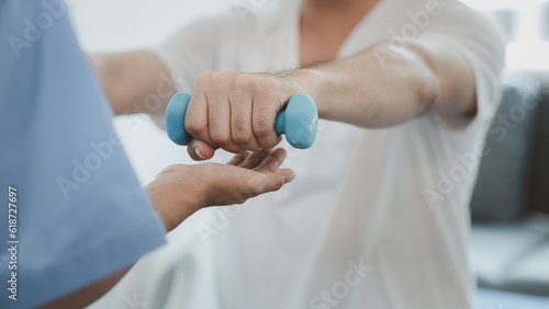 A professional physiotherapist is doing stretching for a patient, the patient has muscle dysfunction due to hard work, most often an office worker who has problems sitting for long periods of time.