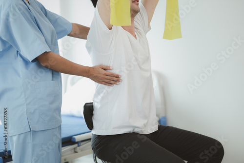 Physiotherapist is doing physical therapy for a patient, the patient has body aches due to overwork and has undergone treatment and physiotherapy with a professional physiotherapist.