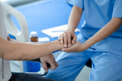 Wallpaper Mural Male patient sitting in wheelchair undergoing a medical examination with specialist physician, treating injuries Getting medical treatment from specialist doctor can get the right and proper treatment Torontodigital.ca