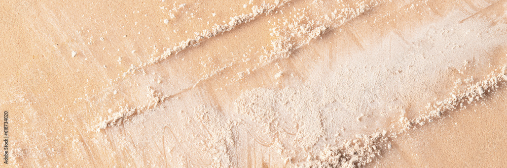 Close up of white beigecrushed powder textureon beige backgroudn for cosmetic banner backdrop