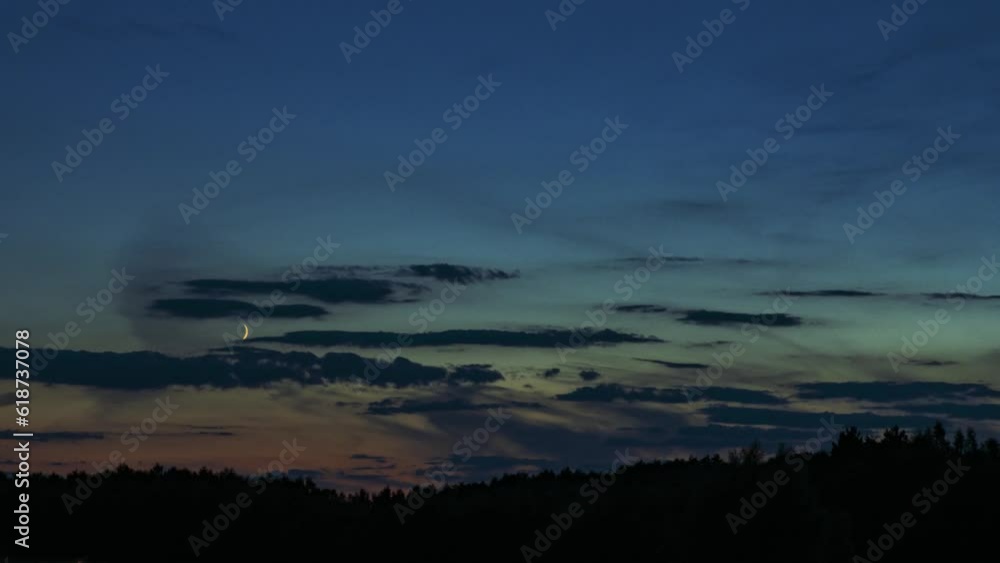 Fast moving clouds in the evening with beautiful moon. Time lapse. 4k footage UHD 3840x2160 Fast moving clouds in the evening with beautiful moon. Time lapse. 4k footage UHD 3840x2160