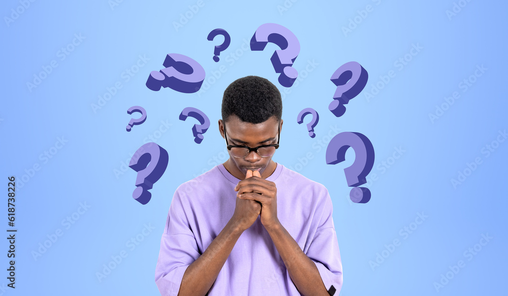 Pensive African man college student and question marks Pensive African man college student and question marks