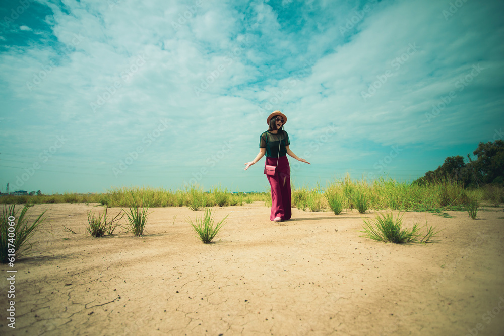 casual woman standing on dirt ground with upset acting casual woman standing on dirt ground with upset acting