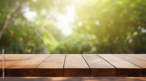 Wooden board empty table top on of blurred background. Perspective brown wood table over blur in yard background © Seption Plus