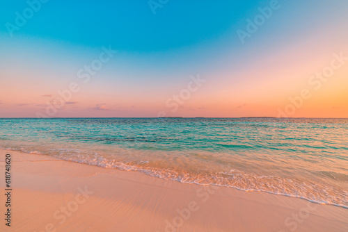Fototapeta Naklejka Na Ścianę i Meble -  Closeup sand sea wave colorful summer panoramic beach landscape. Coast tropical island and seascape. Orange gold sunset sky, soft sandy calm tranquil Mediterranean relax sunlight, peaceful zen horizon