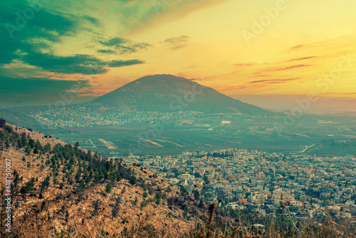 View from Mount Precipice to the Tavor mountain reserve and the Arab villages of Iksal and Daburiyya in northern Israel, southeast of Nazareth photo