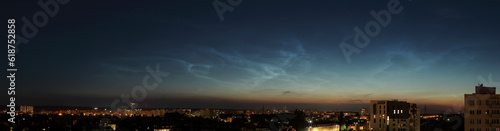 High resolution night panorama of Gdansk, Poland with noctilucent clouds (NLC) shining in the sky.