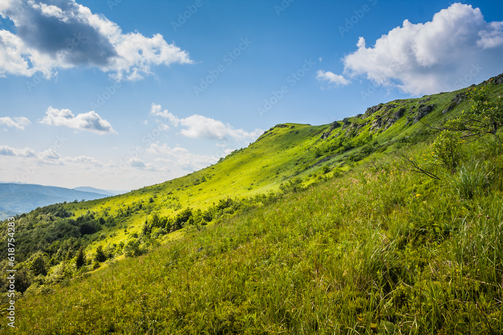 Fototapeta premium Beautiful view on the Ukrainian Polonynian Beskids to the mountains and valleys. Rocky peaks of the Ukrainian Carpathians in summer. Water-making ridge in the Carpathians, Carpathian mountains