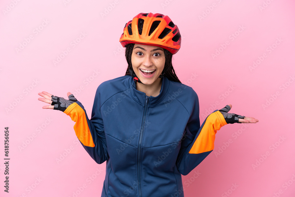 Teenager cyclist girl isolated on pink background with shocked facial expression Teenager cyclist girl isolated on pink background with shocked facial expression