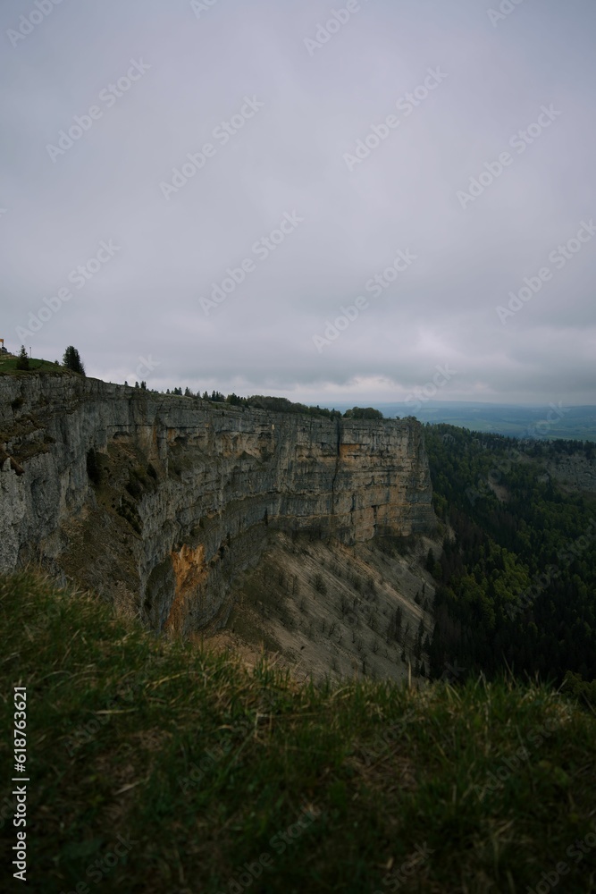 View of Creux du Van on a cloudy day. Swiss canton of Neuchatel, Switzerland.