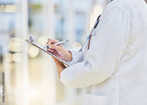Hands, person or doctor writing on clipboard, documents or administration of healthcare schedule. Closeup of medical worker, pen or report of insurance checklist, contract or paper script in hospital