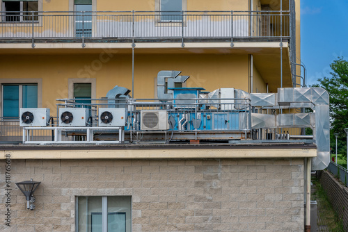 Air conditioning units (HVAC) with compressors installed outside the building © framarzo